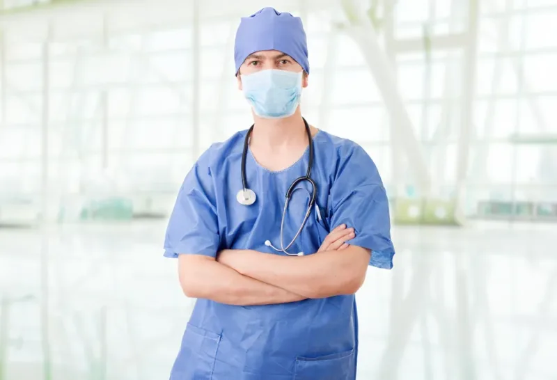 Handsome surgeon wearing surgical cap